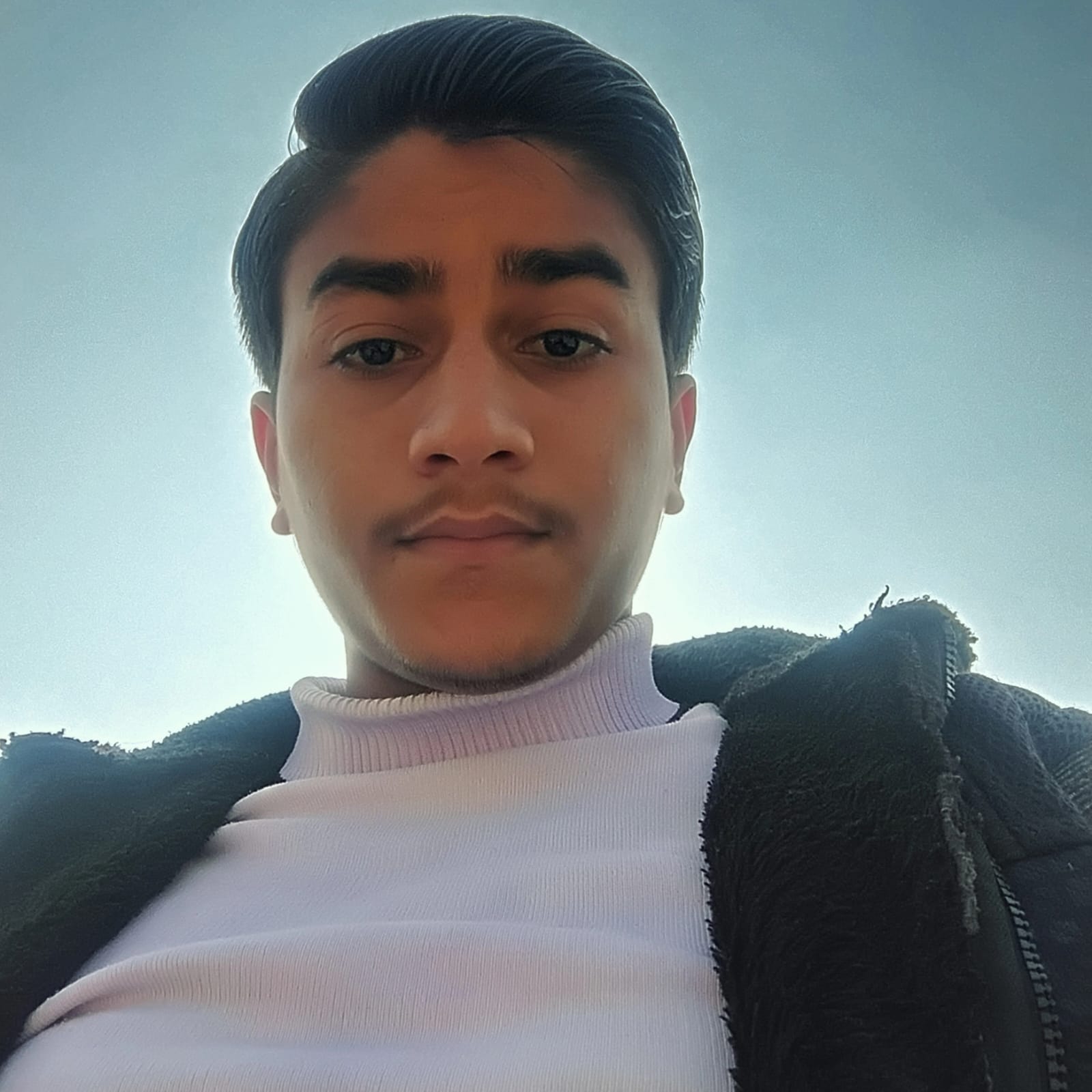 Aditya Gupta portrait against the sky